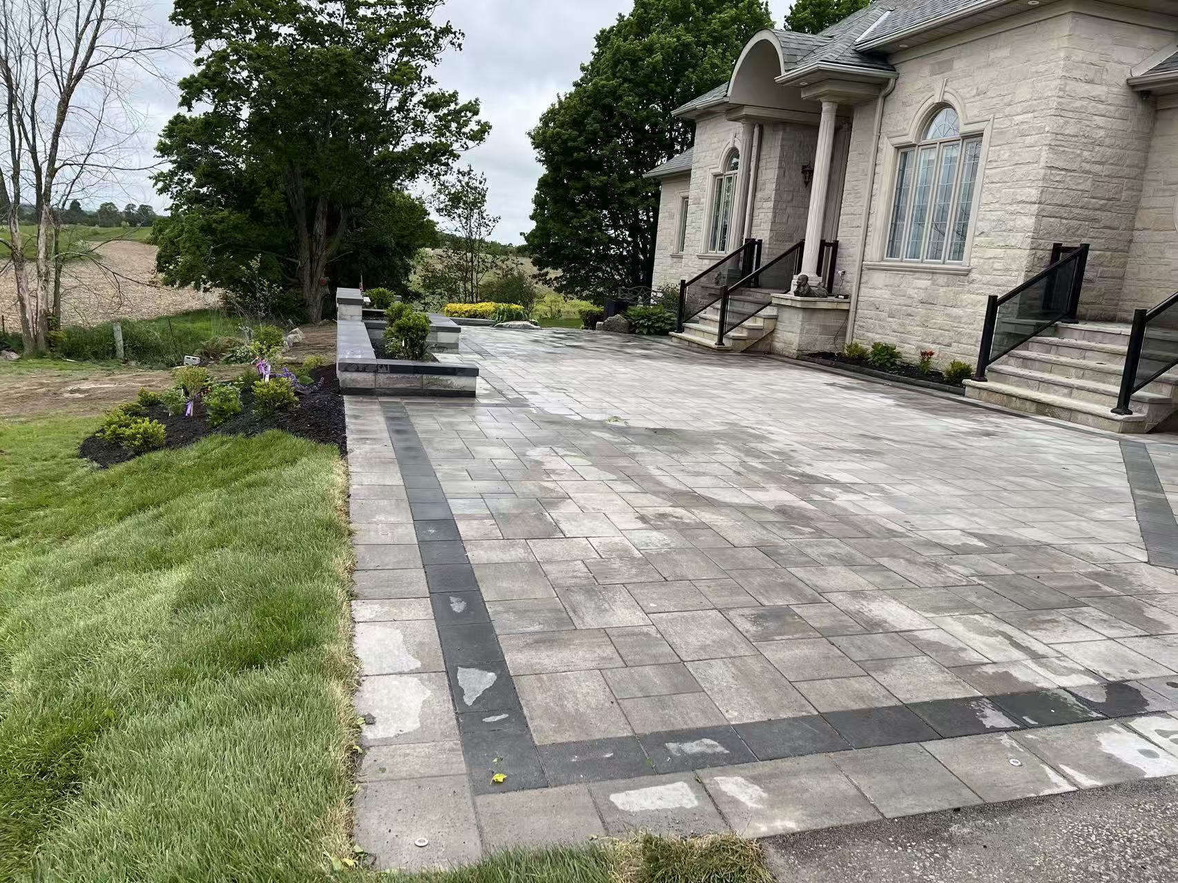 Finished interlocking driveway with banded border, matching the 3D rendering